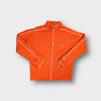 Orange Nike zip-up track jacket with white trim piping on sleeves and chest badge
