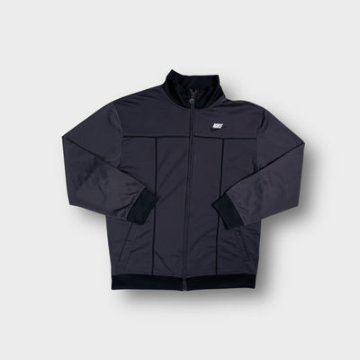 Nike full-zip track jacket in grey featuring embroidered chest logo and dark piping.