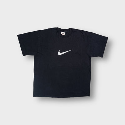 Nike T-Shirt in black featuring a printed white swoosh logo on the center chest