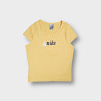 Yellow Nike cap-sleeve T-Shirt with a white swoosh and black cursive chest logo