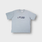 Adidas T-Shirt in grey featuring a central football boots graphic and three stripes