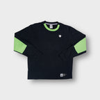 Nike sweater in black with green collar trim and a Playmaker number 10 patch at the hem