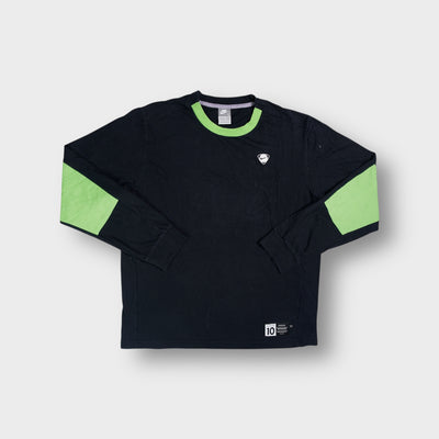 Nike sweater in black with green collar trim and a Playmaker number 10 patch at the hem
