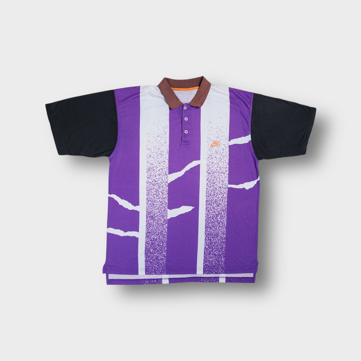 Nike polo shirt in purple featuring abstract graphic print and embroidered chest logo