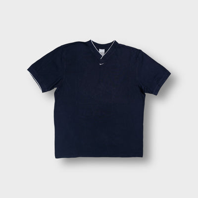 Nike T-Shirt in black featuring a contrast-trimmed V-neck and central swoosh embroidery.