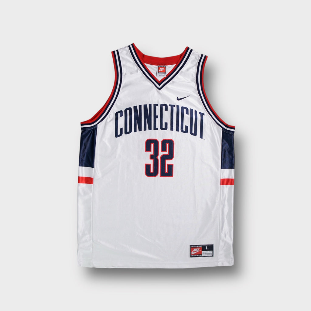 Nike basketball jersey in white featuring navy blue Connecticut text and red number 32 print