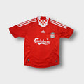 Red Adidas Liverpool FC football jersey with white Carlsberg sponsor across the chest