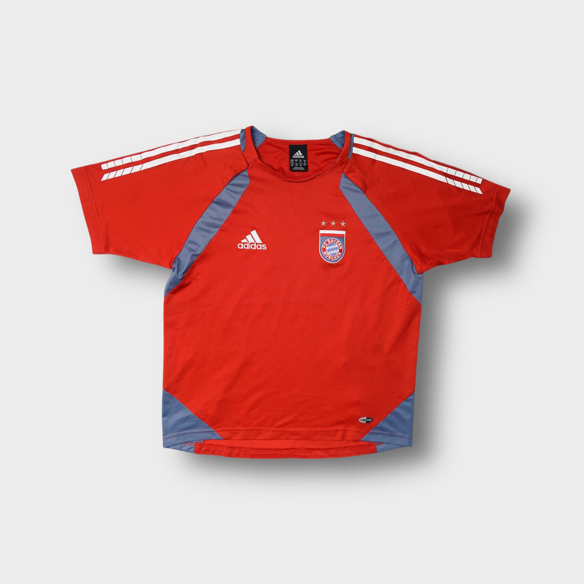 Red Adidas FC Bayern Munich jersey with embroidered team crest and white stripes.