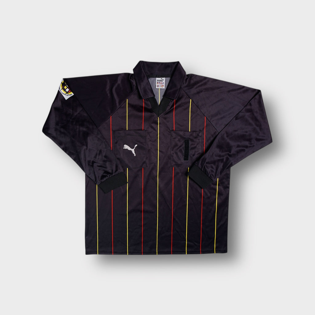 Black Puma long sleeve referee jersey with red and yellow vertical pinstripes