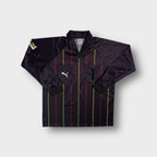 Black Puma long sleeve referee jersey with red and yellow vertical pinstripes