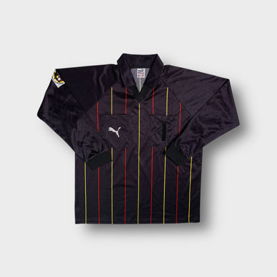 Black Puma long sleeve referee jersey with red and yellow vertical pinstripes