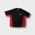The North Face x Undercover SOUKUU short-sleeve shirt in black and red with small chest logo.
