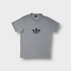 Adidas T-Shirt in grey featuring a black trefoil logo printed on the chest