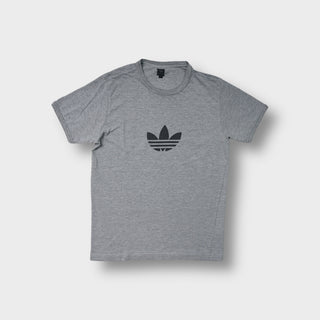 Adidas T-Shirt in grey featuring a black trefoil logo printed on the chest