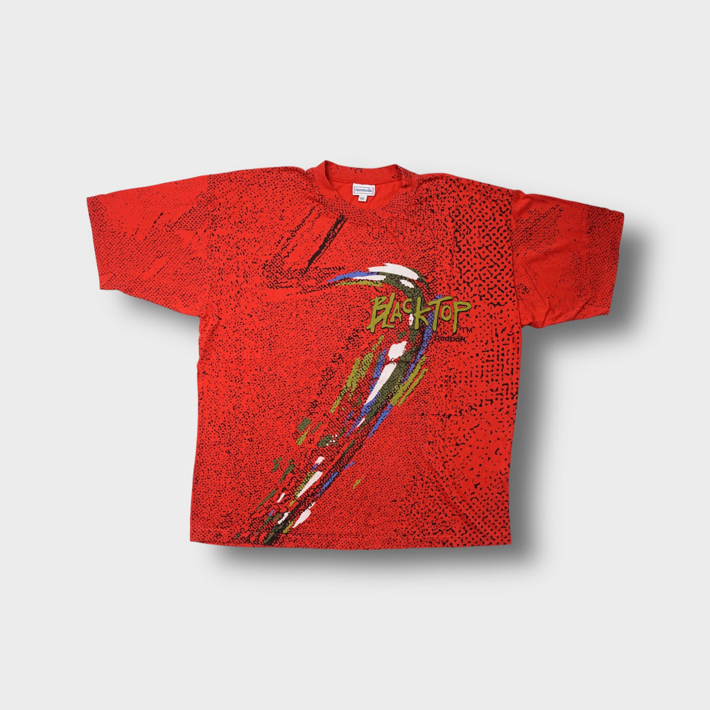 Reebok T-Shirt in red featuring a Blacktop basketball graphic and black speckled pattern.
