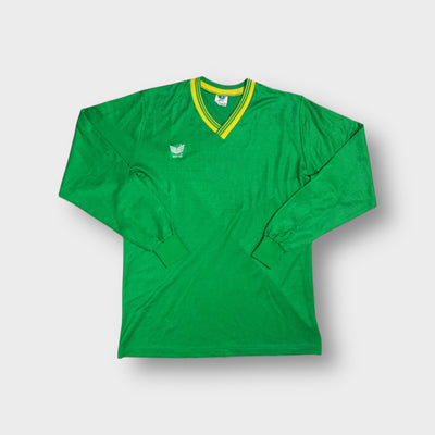 Green Erima jersey featuring a yellow striped V-neck trim and white chest logo