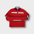 Lacoste long-sleeve polo sweater in red featuring chest stripes and embroidered crocodile logo.