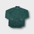 Green Tommy Hilfiger long-sleeve button-down shirt with chest pocket and embroidered crest