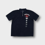 Hard Rock Cafe polo shirt in black with vertical chest print and Marbella back text