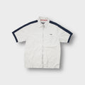 Beige Schott NYC short-sleeve zip shirt with navy shoulder stripes and embroidered chest logo