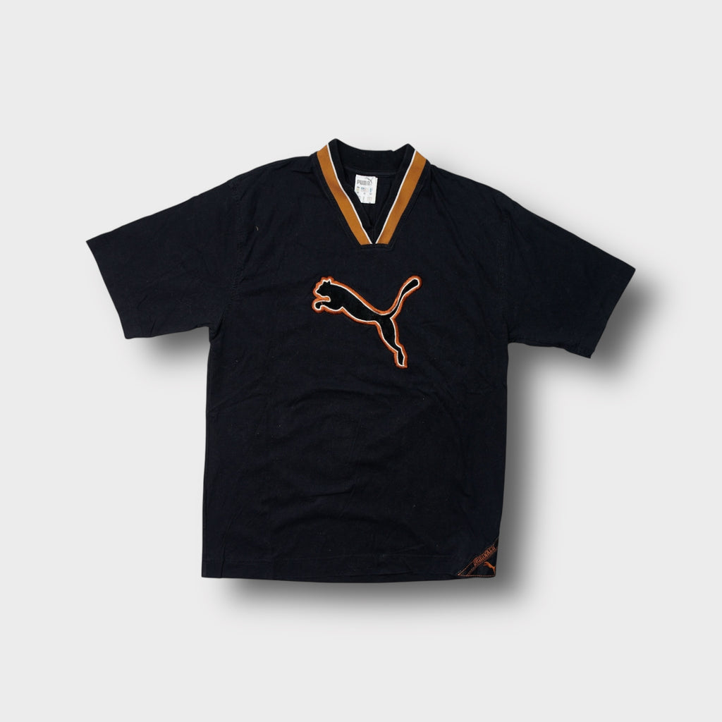 Puma T-Shirt in black with an orange ribbed V-neck collar and large chest patch logo