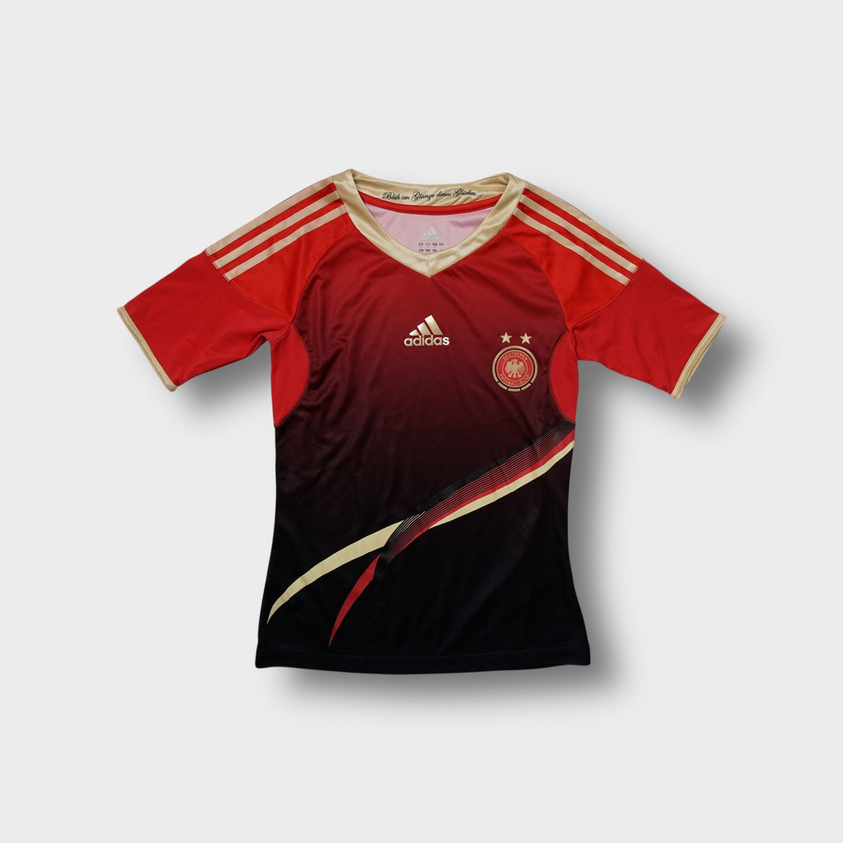 Red Adidas DFB 2012 football jersey with gold V-neck collar and embroidered crest