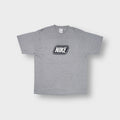Nike grey T-Shirt with a black and white framed logo graphic on the chest