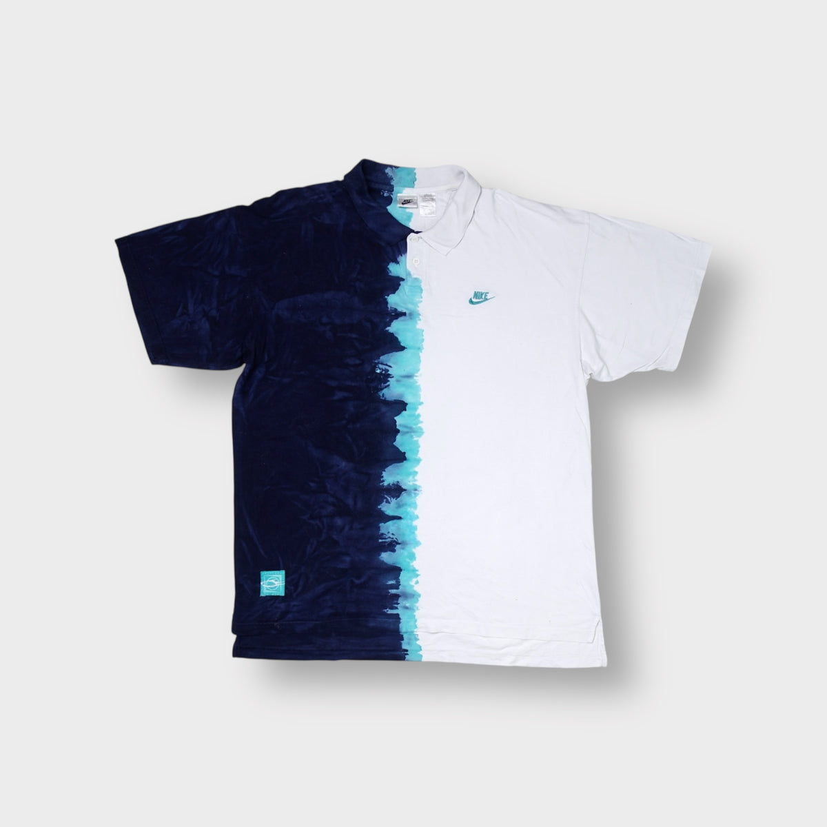 Nike polo shirt in white and navy tie dye with embroidered chest logo and hem patch