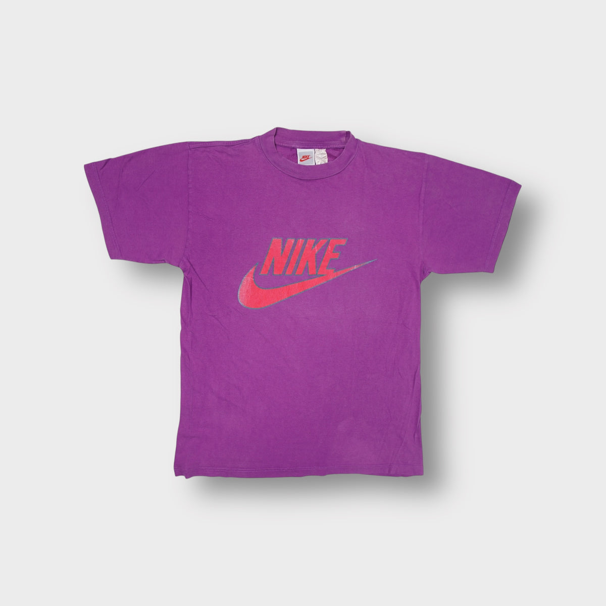 Vintage Nike purple T-Shirt with a red swoosh logo chest print
