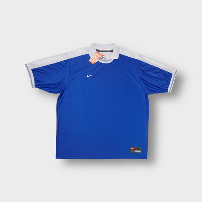 Blue Nike jersey polo shirt with white collar and small embroidered chest swoosh.