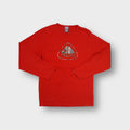Red Nike ACG long sleeve shirt featuring a camouflage triangle logo chest graphic.