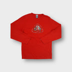 Red Nike ACG long sleeve shirt featuring a camouflage triangle logo chest graphic.