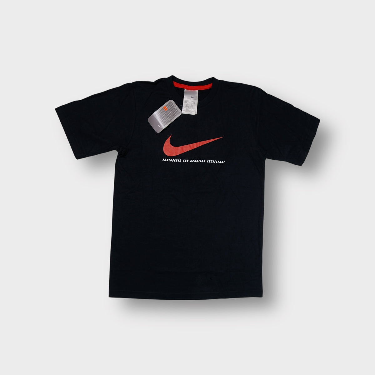 Black Nike T-Shirt featuring a large orange swoosh front print with original tags attached