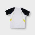 Nike training shirt in white featuring black raglan sleeves and yellow accent panels.