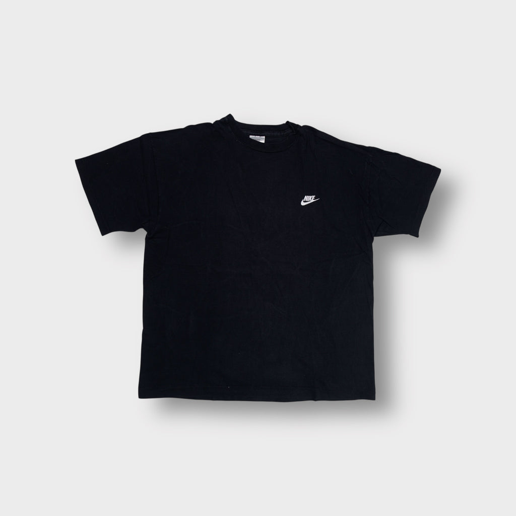 Black Nike T-Shirt featuring a small white embroidered swoosh logo on the chest