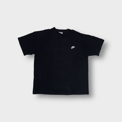 Black Nike T-Shirt featuring a small white embroidered swoosh logo on the chest