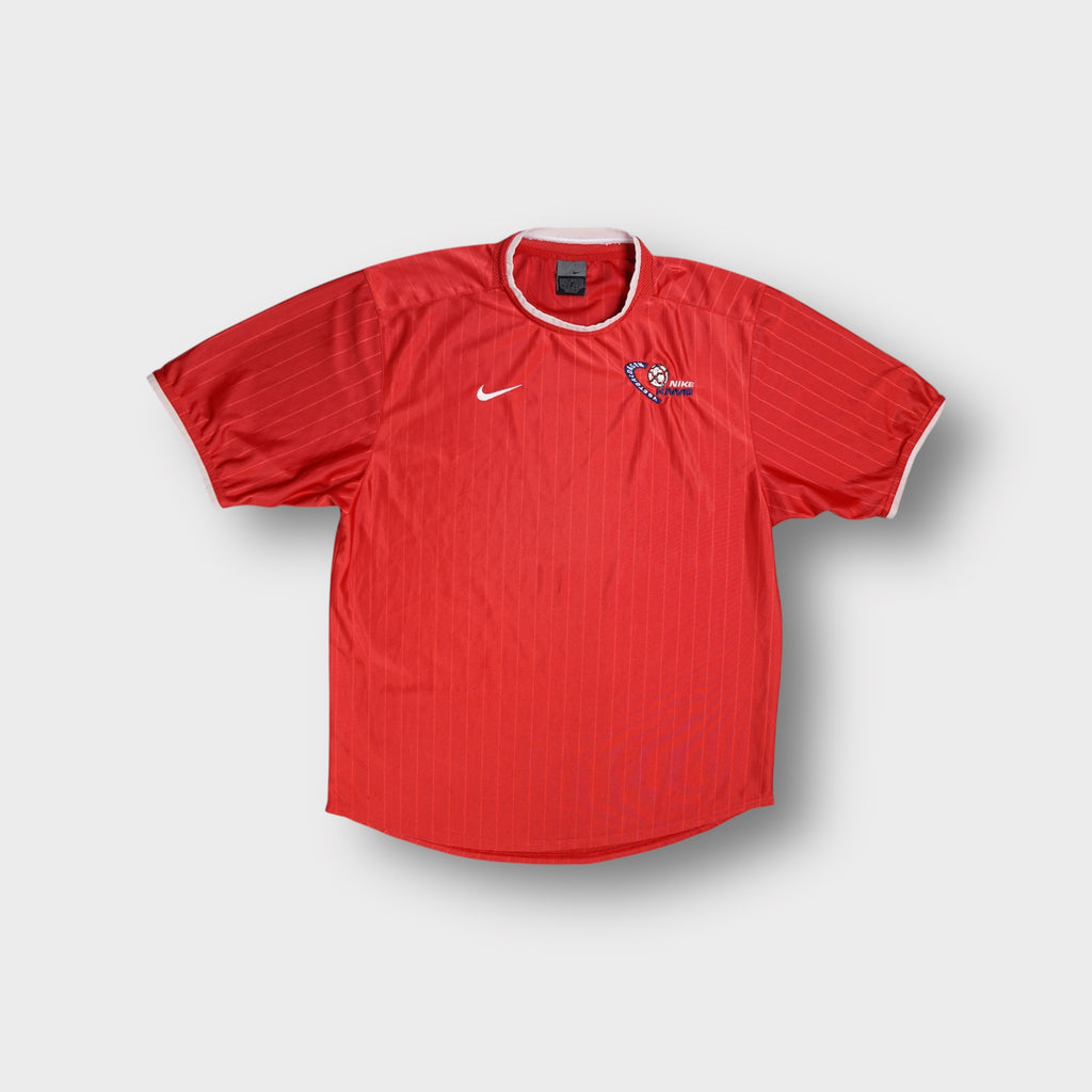 Nike football shirt in red featuring white swoosh and KNVB embroidery on chest