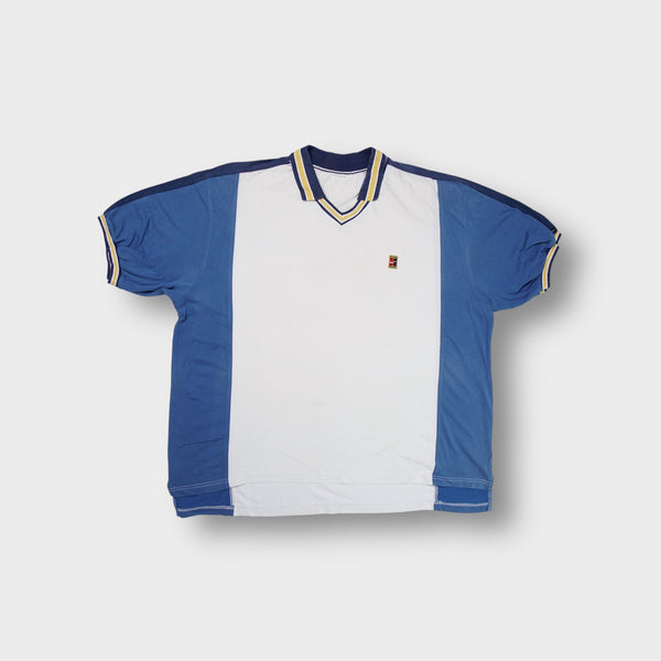 Nike beige tennis polo shirt with blue panels and embroidered court logo on chest