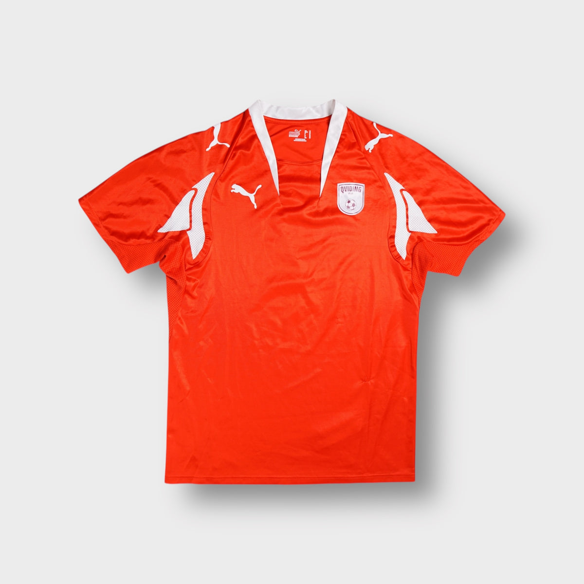 Puma Qviding FIF football jersey in red with white accents and crest badge