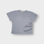Nike grey T-Shirt with a stylized swoosh graphic on the lower left hem