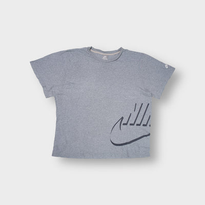 Nike grey T-Shirt with a stylized swoosh graphic on the lower left hem