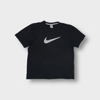 Nike short-sleeve T-Shirt in black featuring a large grey Swoosh printed on the chest