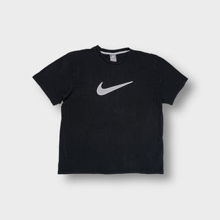 Nike short-sleeve T-Shirt in black featuring a large grey Swoosh printed on the chest