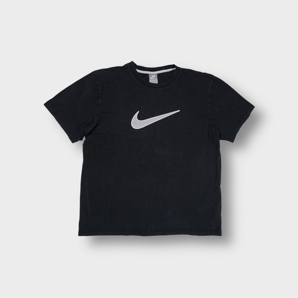 Nike short-sleeve T-Shirt in black featuring a large grey Swoosh printed on the chest