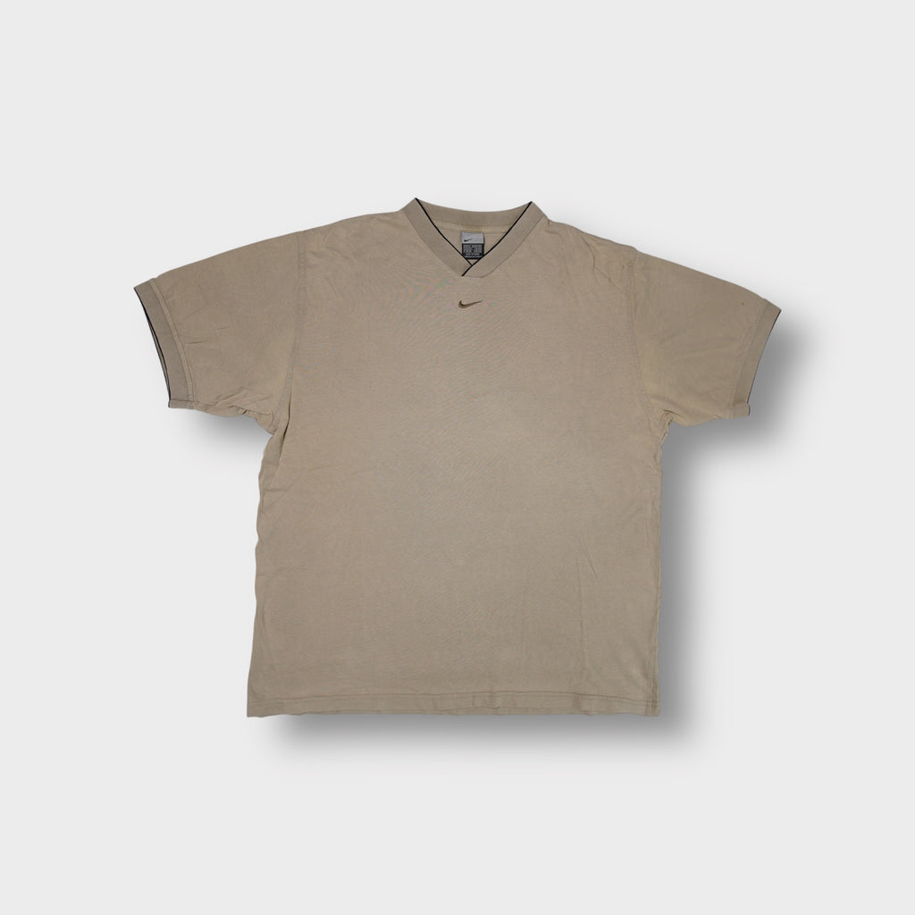 Nike T-Shirt in beige featuring a ribbed V-neck collar and embroidered chest swoosh