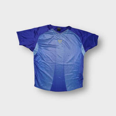 Blue Nike shirt with a small embroidered logo on the chest and vertical line design.