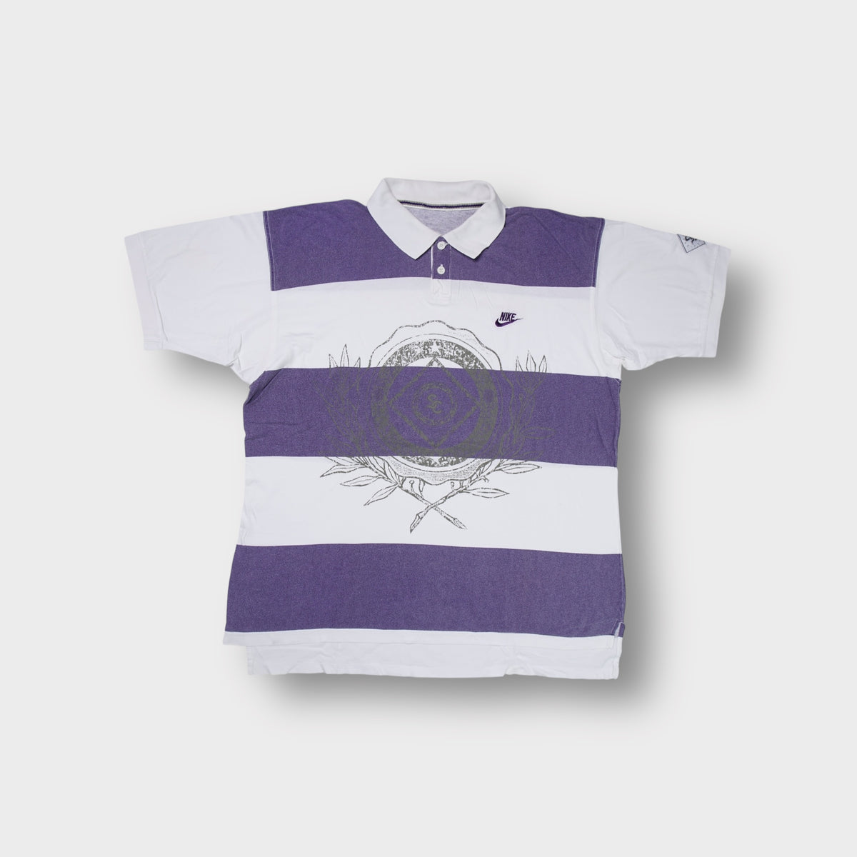Nike polo shirt in white and purple with broad stripes and front graphic print