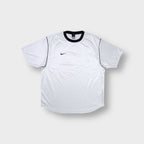 White Nike shirt featuring a black crew neck collar and embroidered swoosh logo