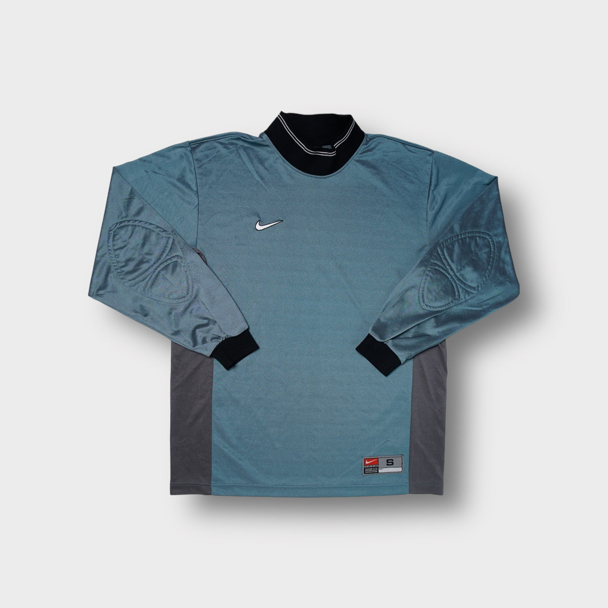 Nike goalkeeper jersey in green and blue with elbow padding and embroidered Swoosh
