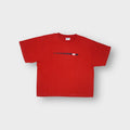 Nike T-Shirt in red featuring a small horizontal graphic print across the chest